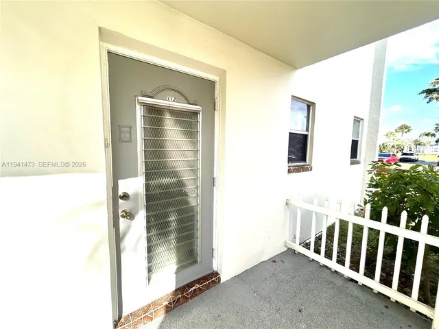 a view of a porch with a door