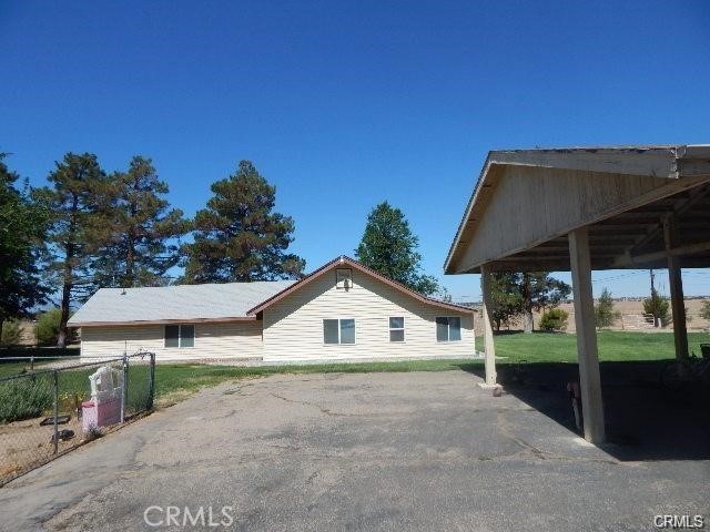 19968 Bear Valley Road Apple Valley, CA 92308 - Photo 2 of 20 a house with trees in the background
