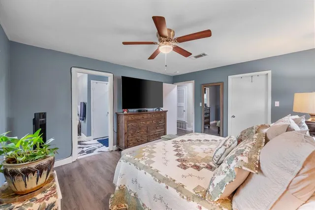 a bed room with a bed and a television