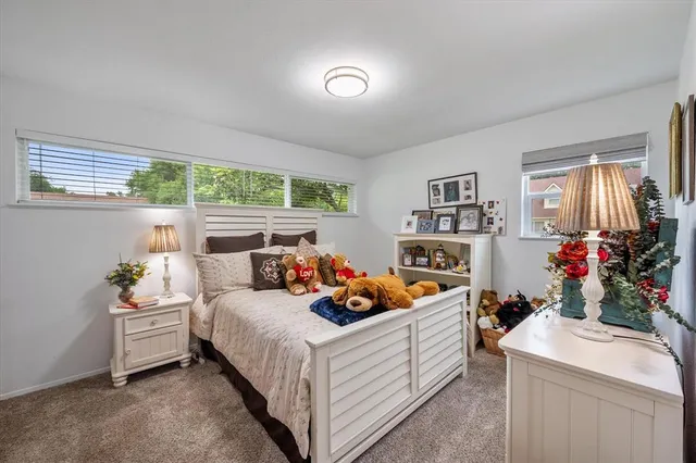 a bed room with a bed and a window