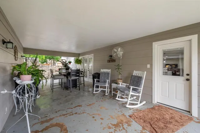 a outdoor space with furniture and potted plants