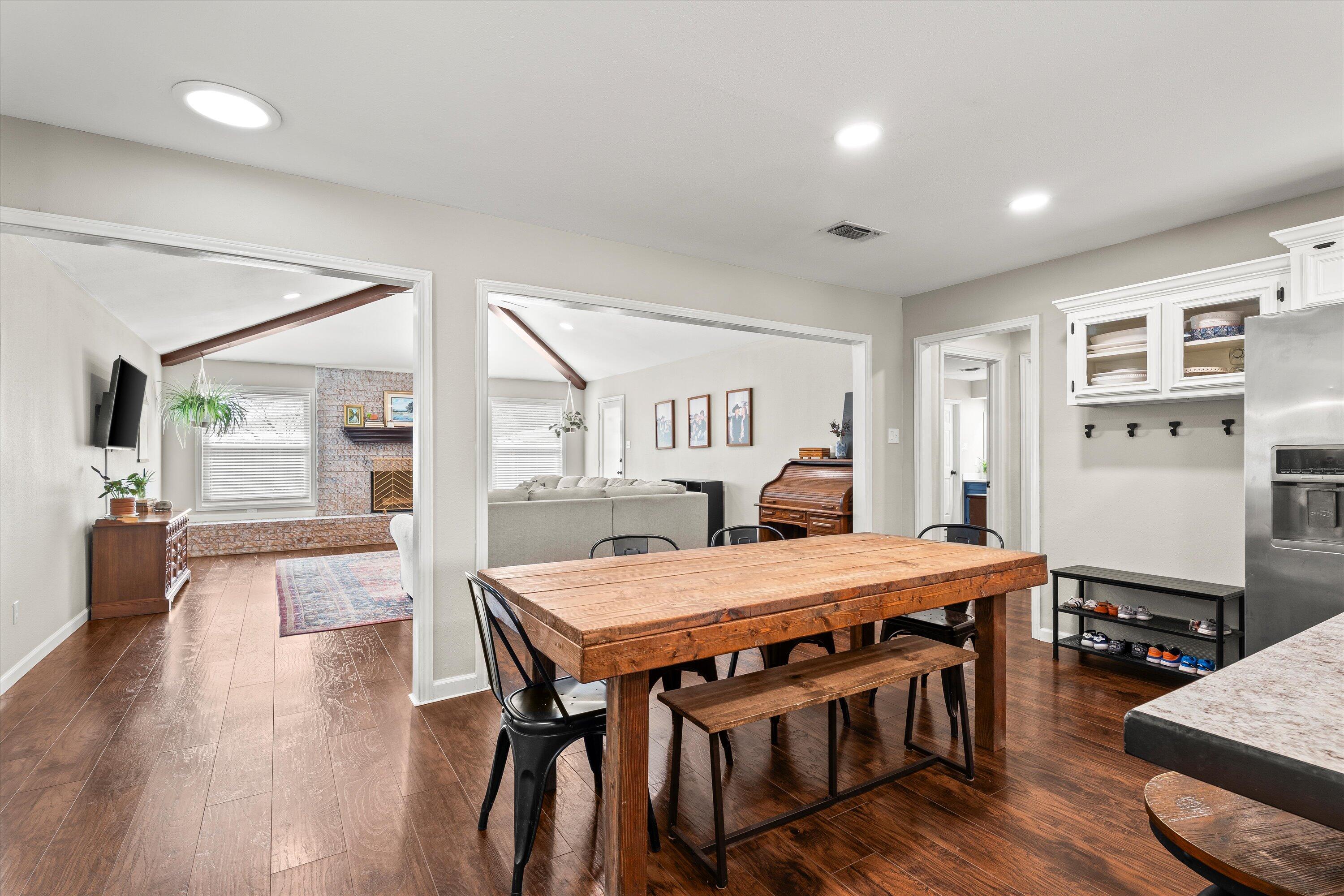 5223 91st Street Lubbock, TX 79424 - Photo 11 of 29 a view of a dining room with furniture window and wooden floor