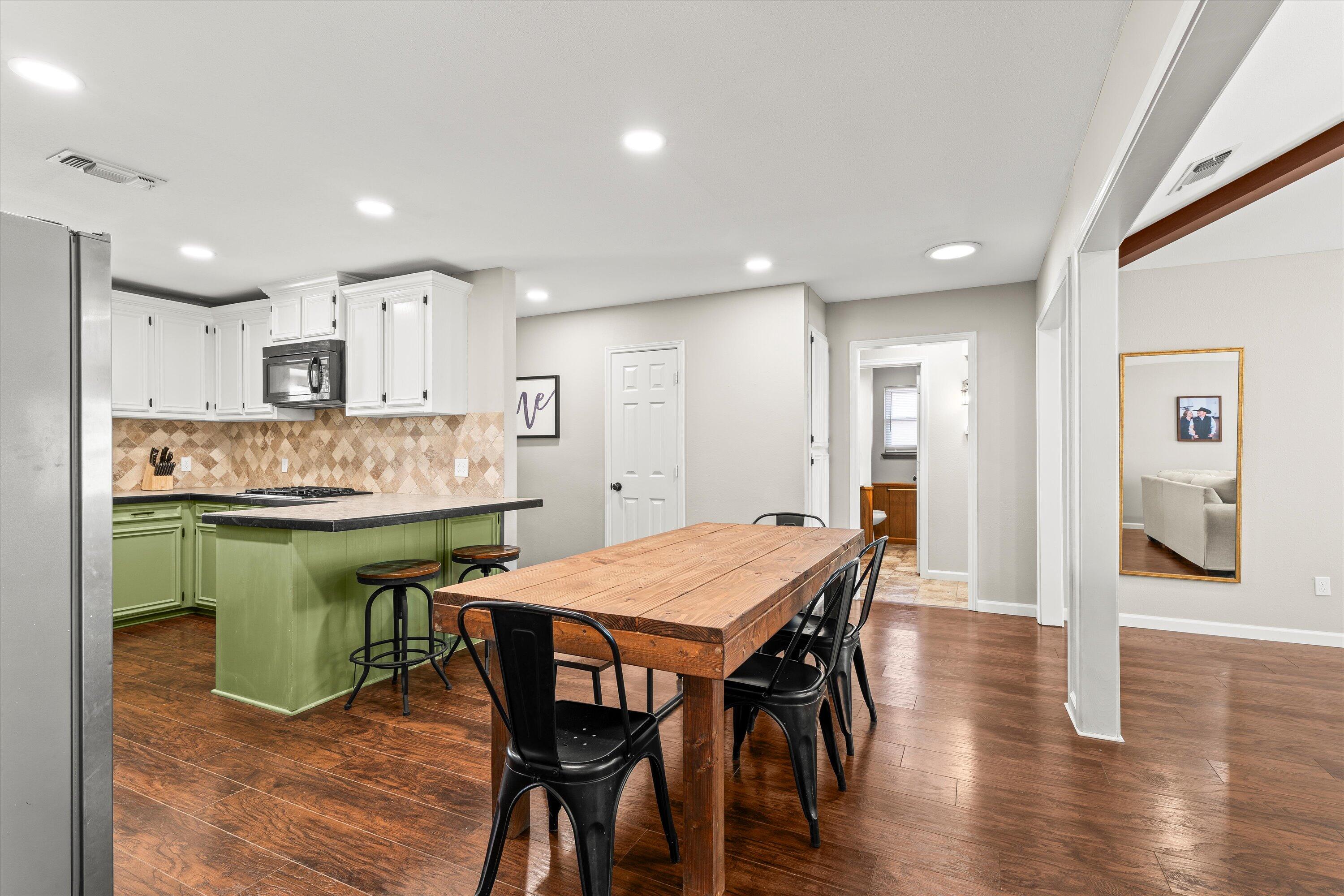 5223 91st Street Lubbock, TX 79424 - Photo 12 of 29 a kitchen with a table and chairs in it