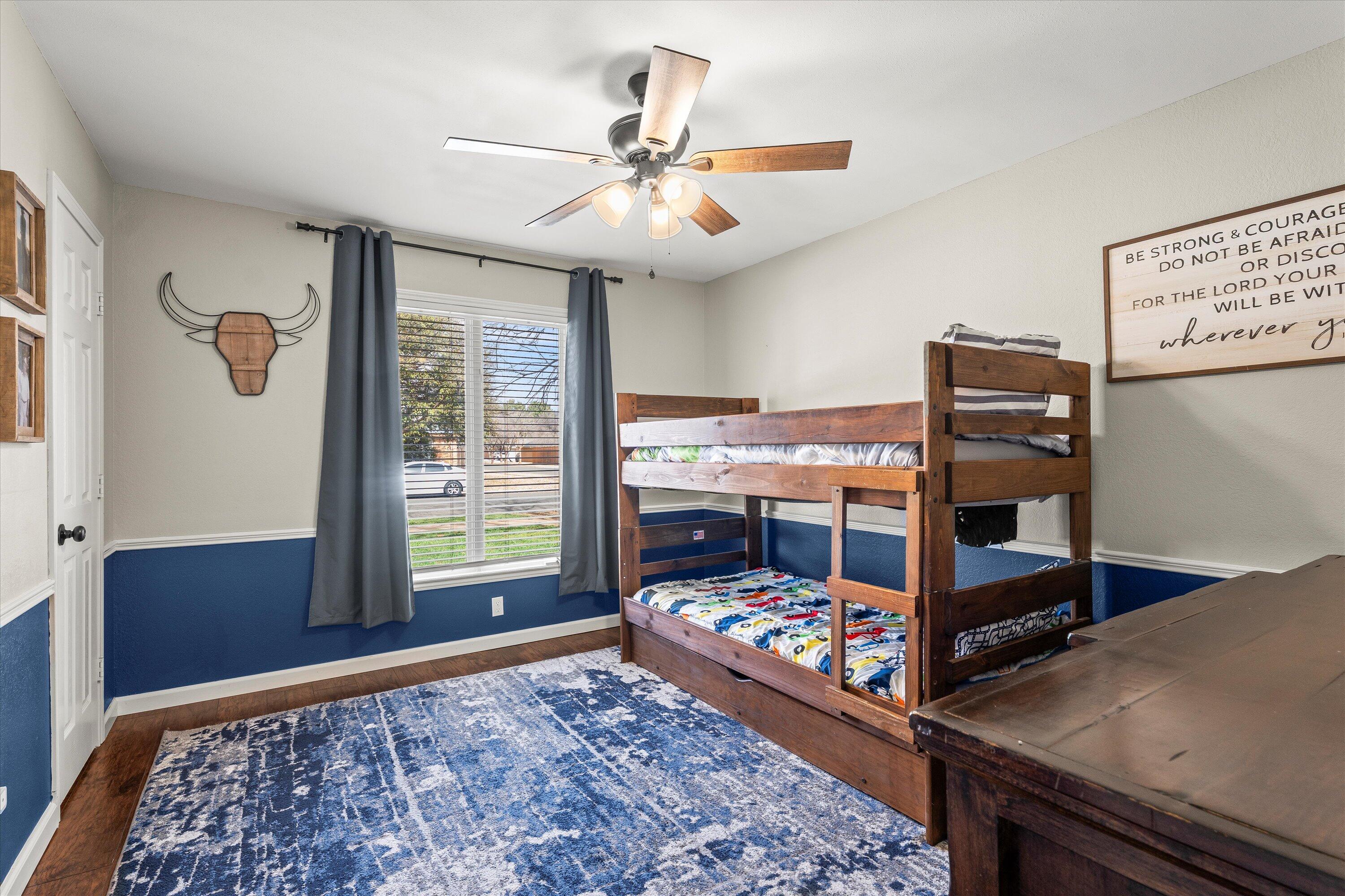 5223 91st Street Lubbock, TX 79424 - Photo 20 of 29 a bed room with a bed and a window