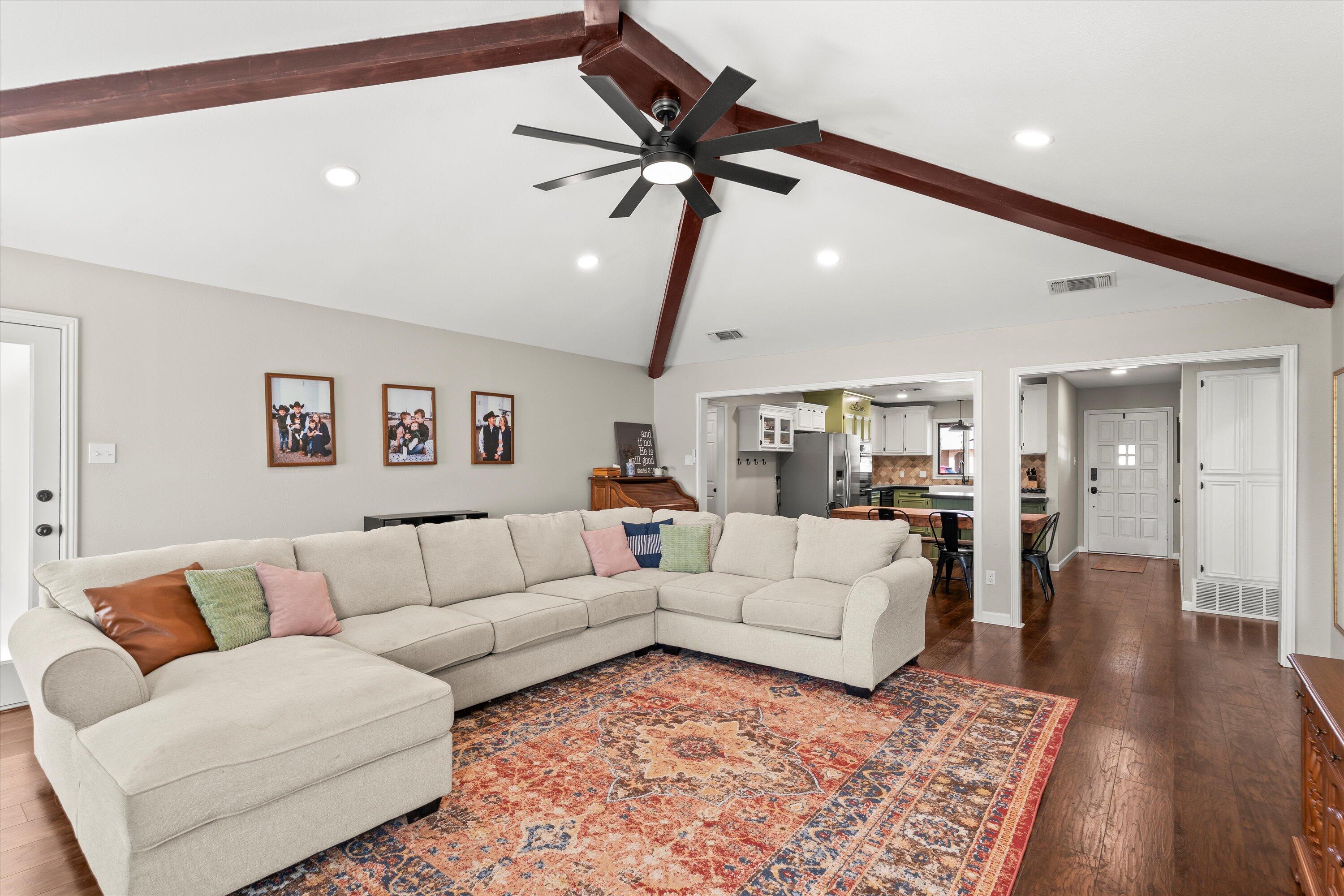 5223 91st Street Lubbock, TX 79424 - Photo 2 of 29 a living room with furniture and a rug