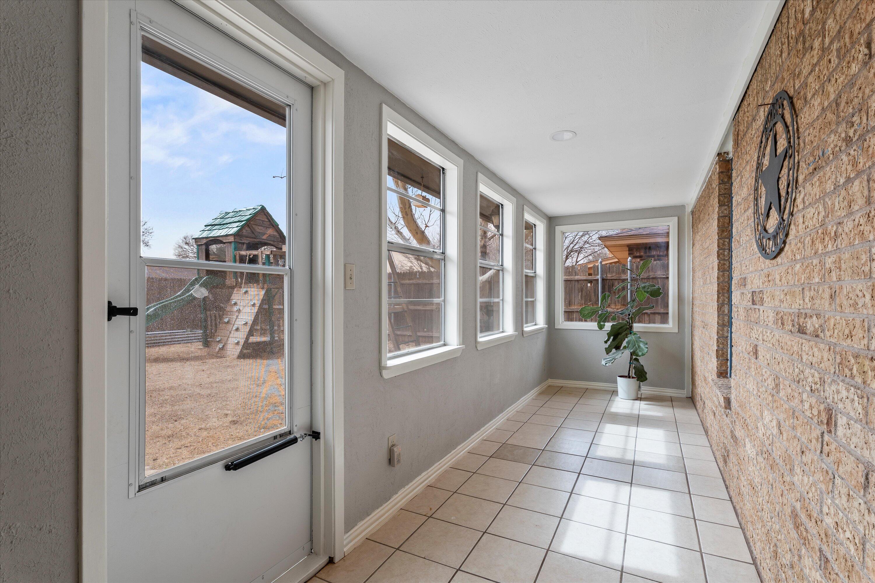 5223 91st Street Lubbock, TX 79424 - Photo 24 of 29 a view of a hallway with windows