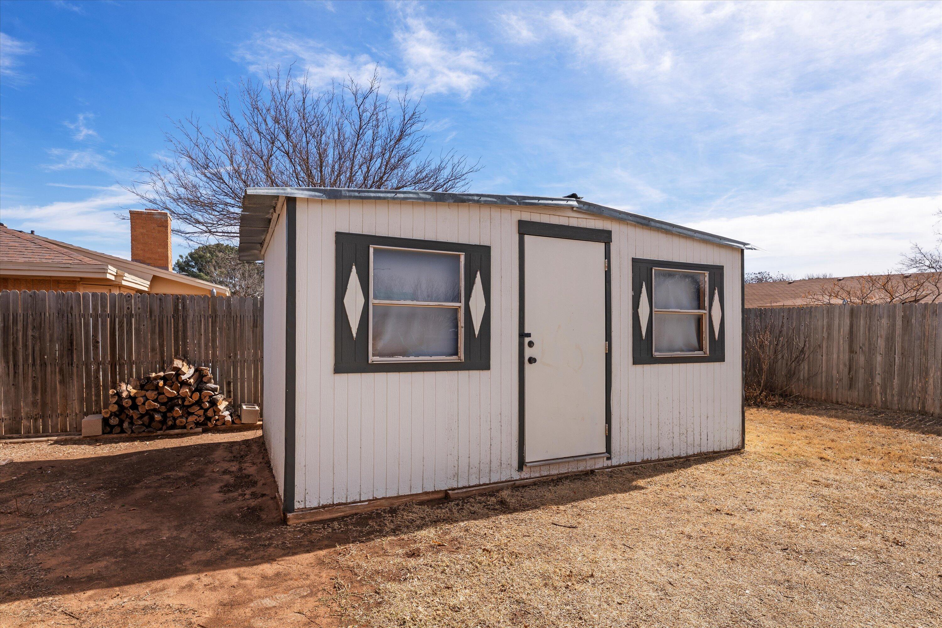 5223 91st Street Lubbock, TX 79424 - Photo 29 of 29 a front view of a house with a yard