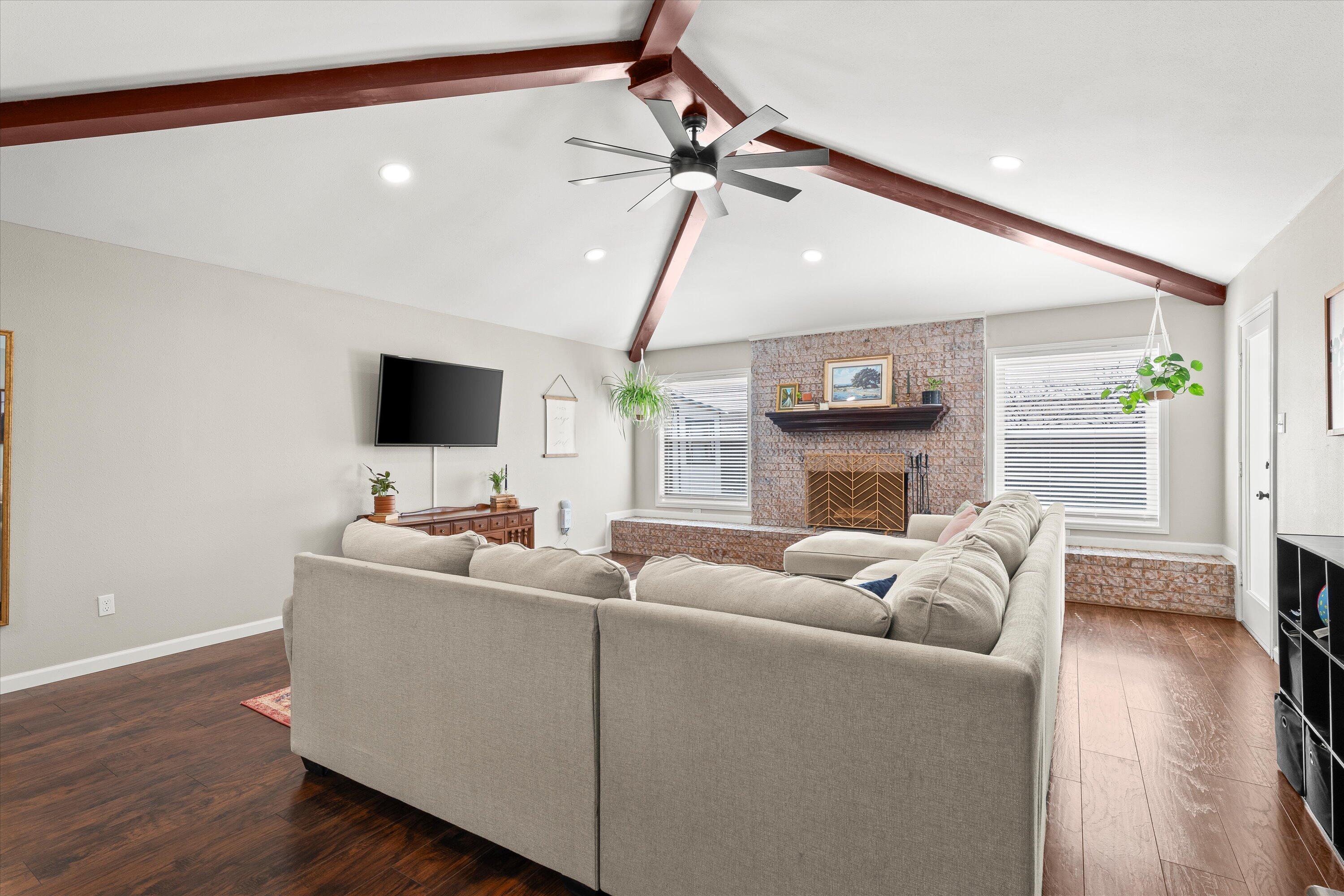 5223 91st Street Lubbock, TX 79424 - Photo 7 of 29 a living room with furniture and a flat screen tv
