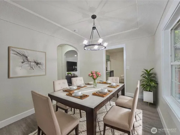 a dining room with a table and chairs