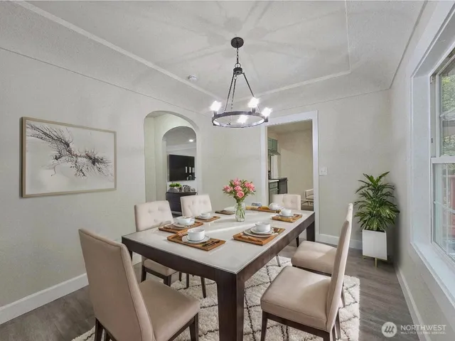 a dining room with a table and chairs