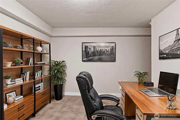 a workspace with furniture and book shelf