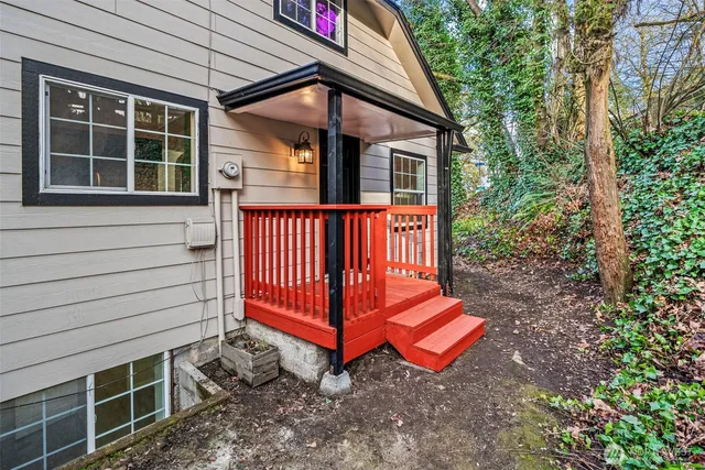 a view of backyard with deck and entertaining space