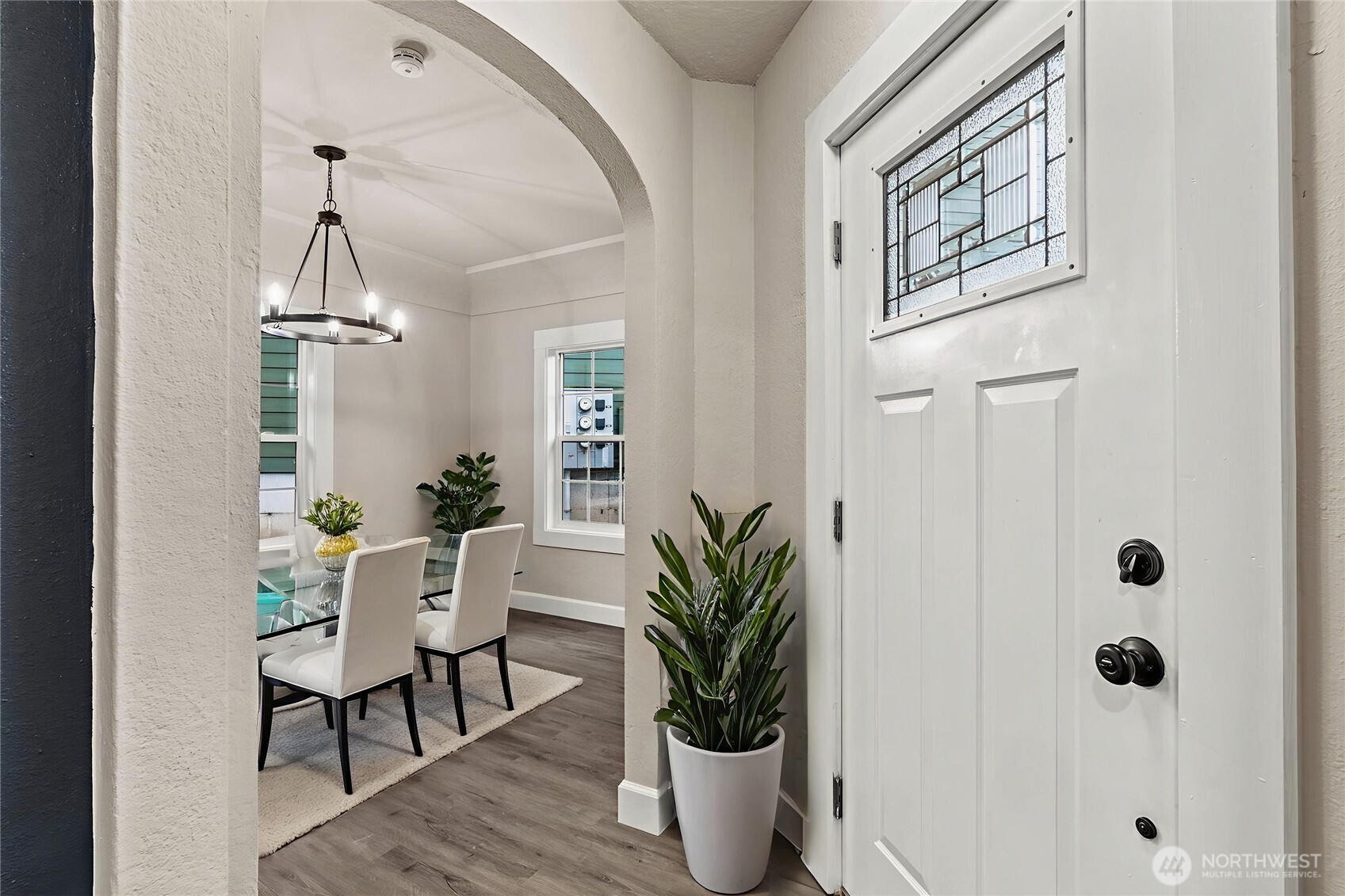 802 Northwest 5th Circle Camas, WA 98607 - Photo 3 of 26 a dining room with furniture potted plants and wooden floor