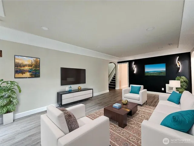 a living room with furniture and a flat screen tv