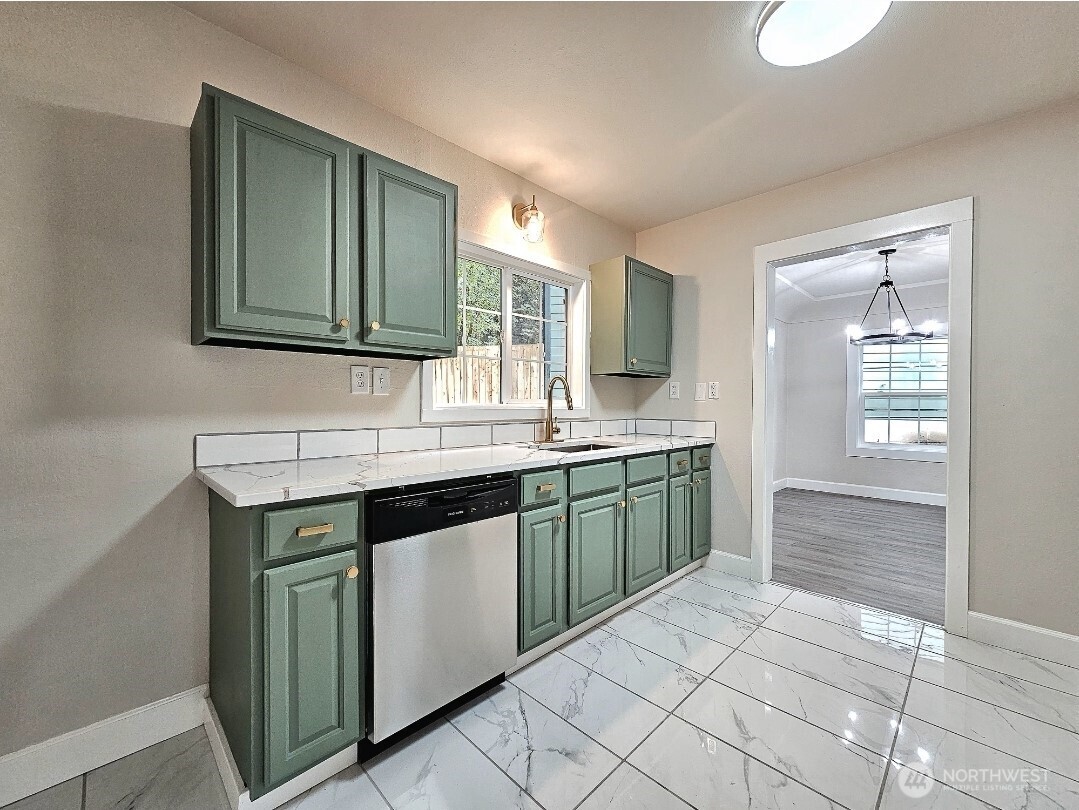 802 Northwest 5th Circle Camas, WA 98607 - Photo 7 of 26 a kitchen with a sink and a cabinets