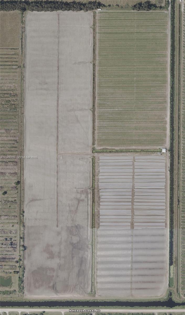 595 North Header Canal Road Fort Pierce, FL 34945 - Photo 11 of 36 a bathroom with a shower