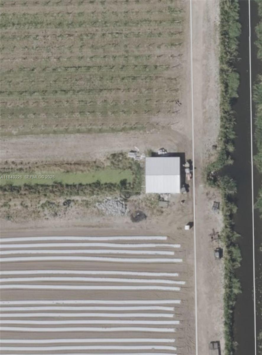 595 North Header Canal Road Fort Pierce, FL 34945 - Photo 16 of 36 a bathroom with a shower