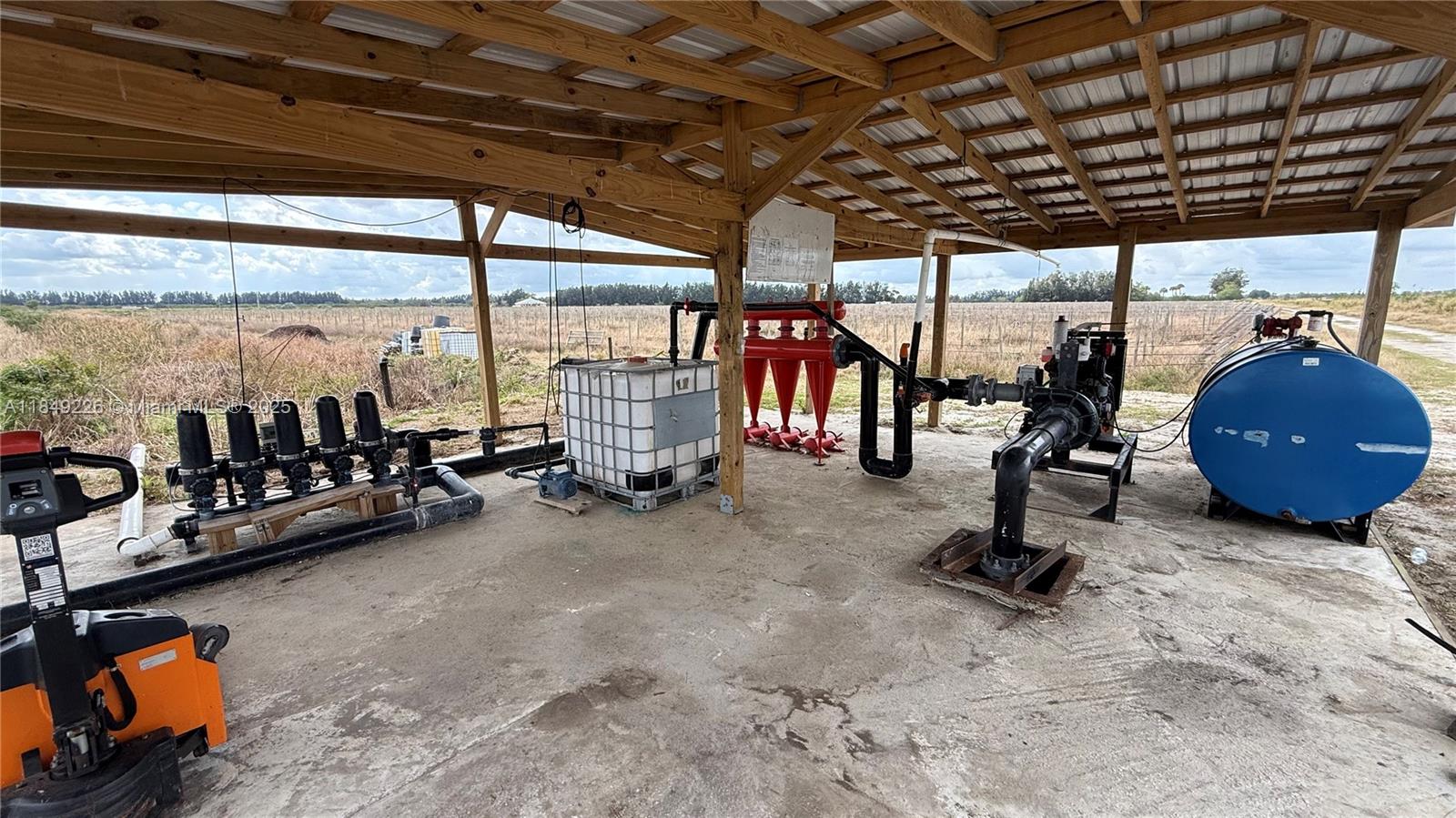 595 North Header Canal Road Fort Pierce, FL 34945 - Photo 21 of 36 a view of a room with gym equipment
