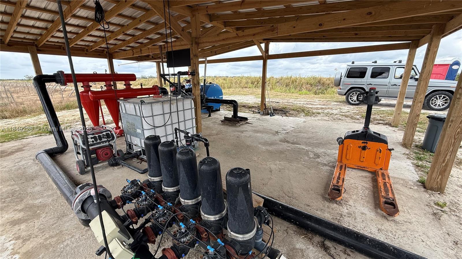 595 North Header Canal Road Fort Pierce, FL 34945 - Photo 22 of 36 a view of a room with gym equipment