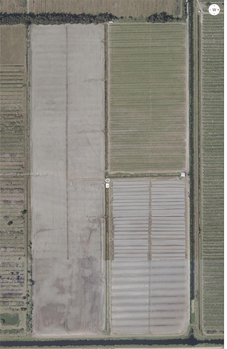 595 North Header Canal Road Fort Pierce, FL 34945 - Photo 25 of 36 a bathroom with a shower