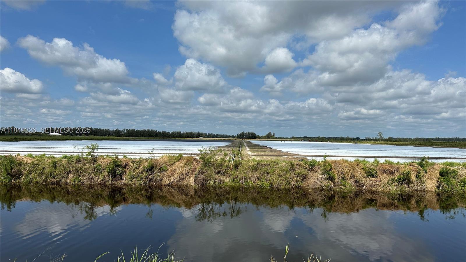 595 North Header Canal Road Fort Pierce, FL 34945 - Photo 3 of 36 a view of a lake view