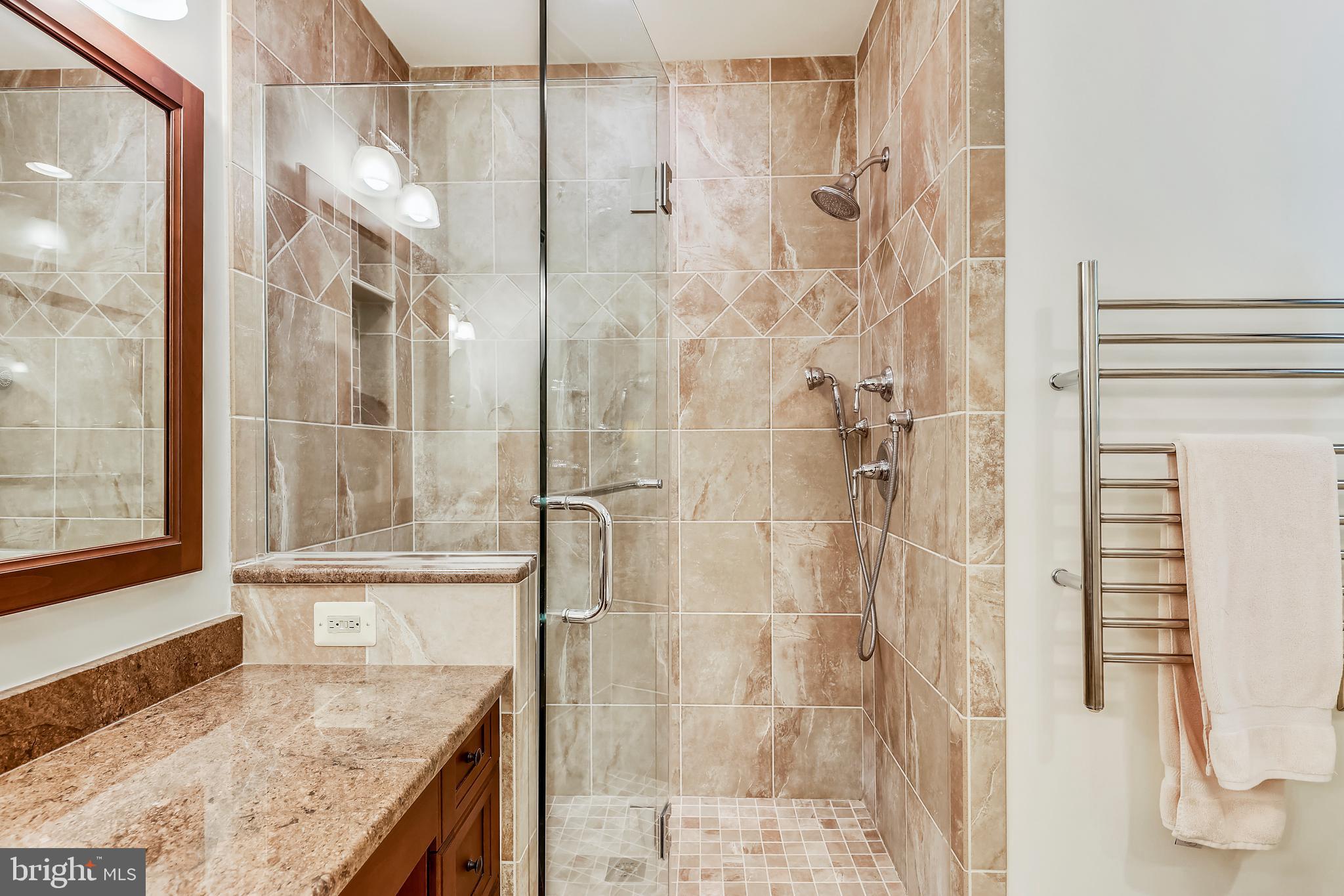 10733 Cross School Road Reston, VA 20191 - Photo 17 of 35 Frameless shower door, ceramic tile, heated towel!