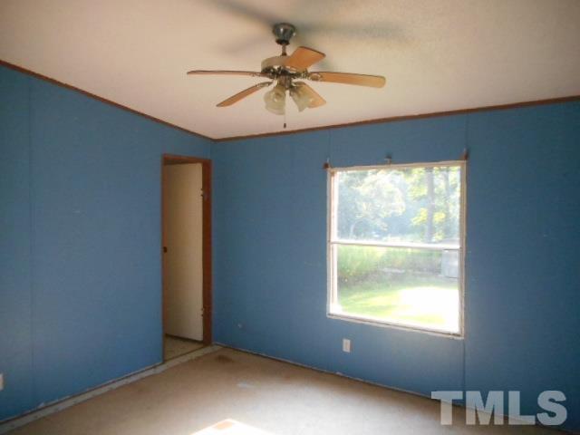 410 W Road Angier, NC 27501 - Photo 8 of 12 a view of an empty room with a window