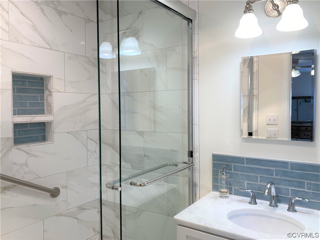 3401 Ellsworth Road Richmond, VA 23235 - Photo 13 of 39 a bathroom with a sink mirror and shower