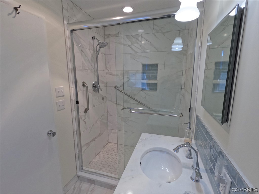 3401 Ellsworth Road Richmond, VA 23235 - Photo 14 of 39 a bathroom with a sink a toilet and shower