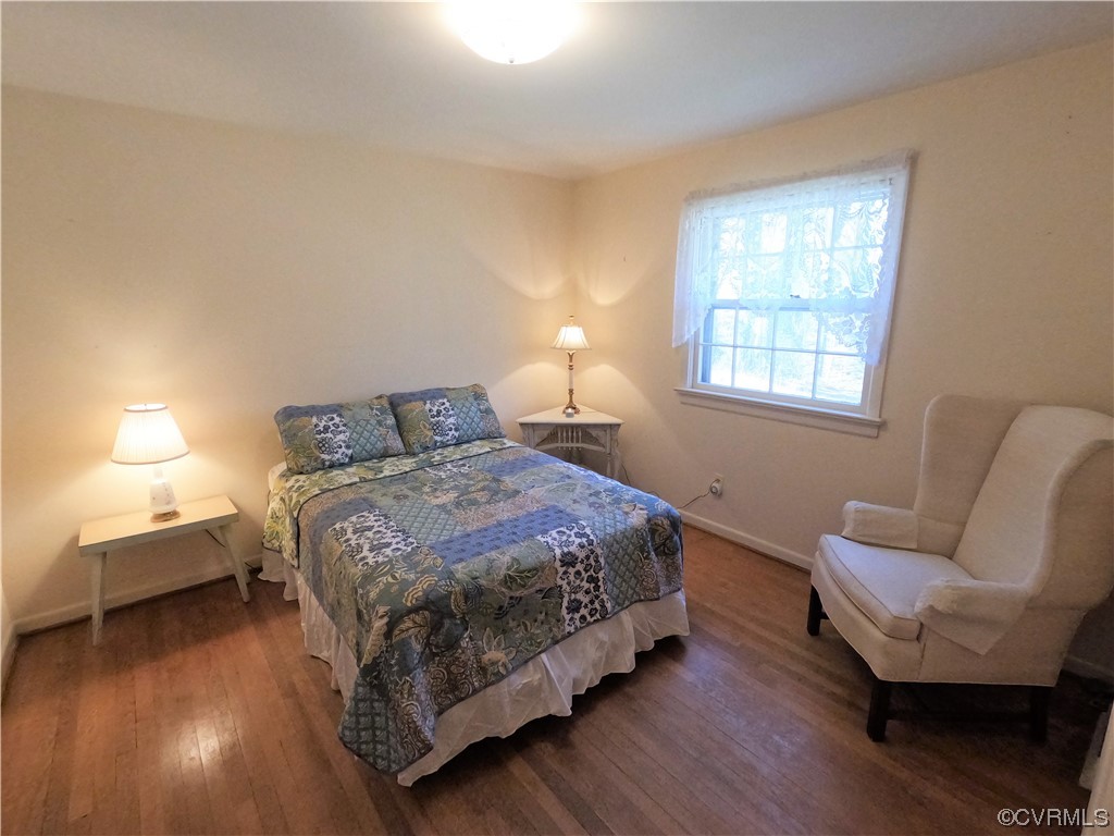 3401 Ellsworth Road Richmond, VA 23235 - Photo 18 of 39 a bedroom with a bed and wooden floor