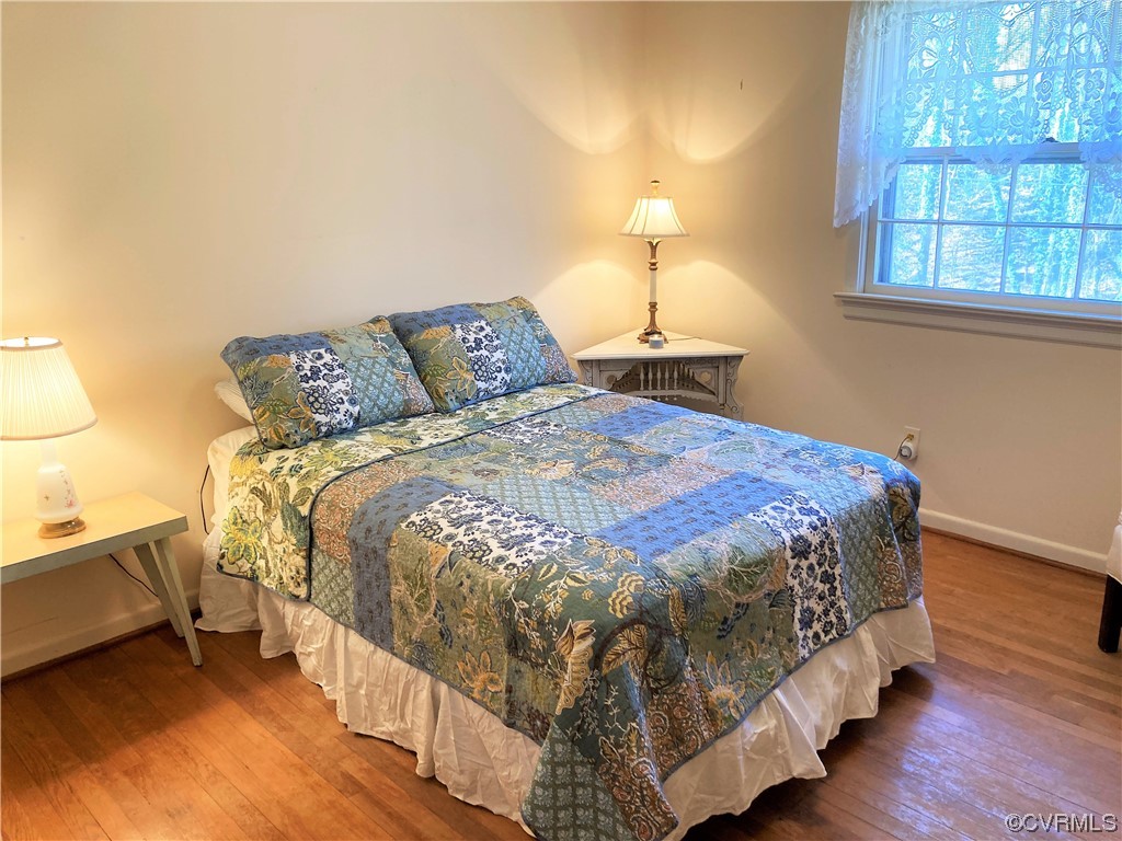 3401 Ellsworth Road Richmond, VA 23235 - Photo 19 of 39 a bed sitting in a bedroom next to a window