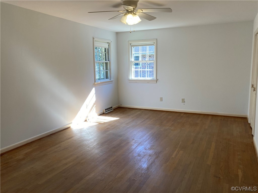 3401 Ellsworth Road Richmond, VA 23235 - Photo 27 of 39 an empty room with wooden floor and windows