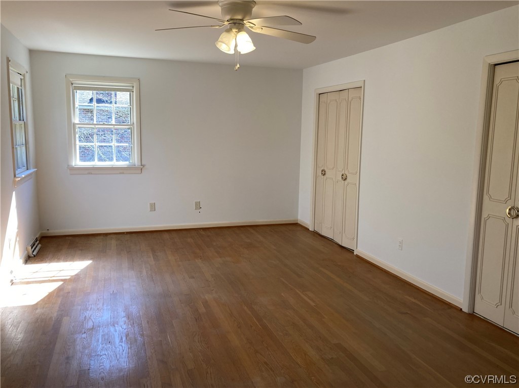 3401 Ellsworth Road Richmond, VA 23235 - Photo 28 of 39 an empty room with wooden floor and windows