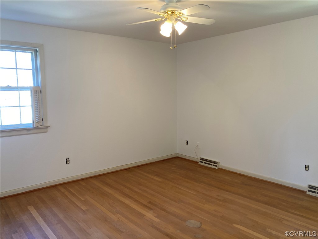 3401 Ellsworth Road Richmond, VA 23235 - Photo 29 of 39 an empty room with wooden floor and windows