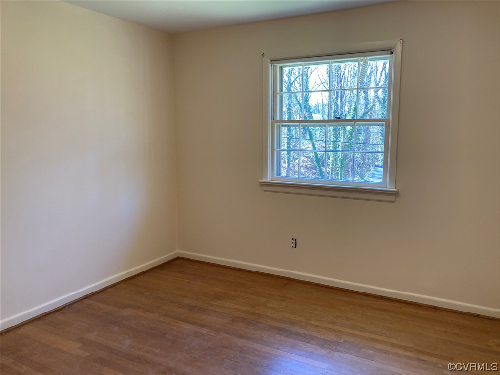 3401 Ellsworth Road Richmond, VA 23235 - Photo 32 of 39 an empty room with wooden floor and windows