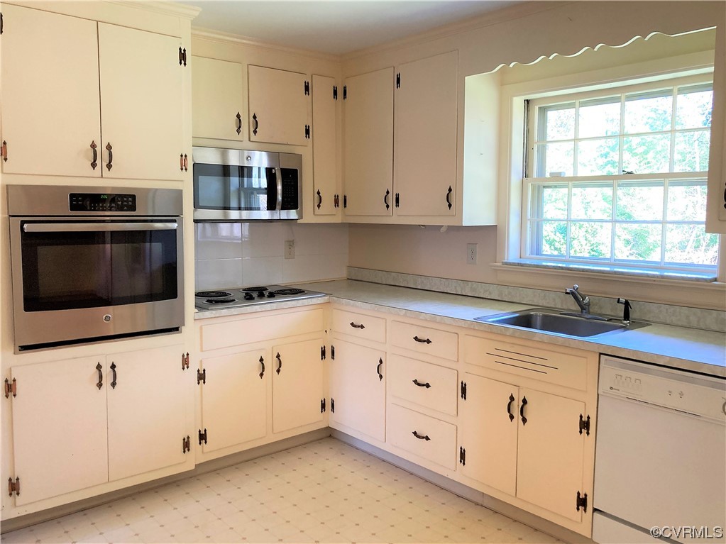 3401 Ellsworth Road Richmond, VA 23235 - Photo 6 of 39 a kitchen with granite countertop white cabinets and stainless steel appliances
