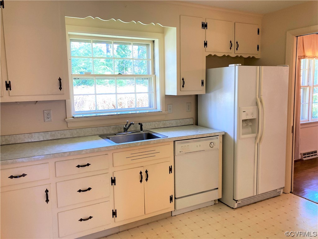 3401 Ellsworth Road Richmond, VA 23235 - Photo 7 of 39 a kitchen with cabinets appliances a sink and a window