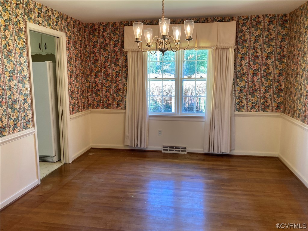 3401 Ellsworth Road Richmond, VA 23235 - Photo 9 of 39 an empty room with wooden floor and windows
