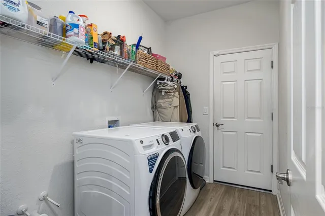 a utility room with dryer and washer