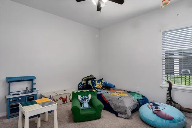 a bedroom with furniture and a wooden floor