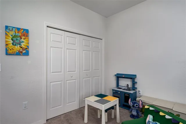 a view of a workspace with furniture and wooden floor