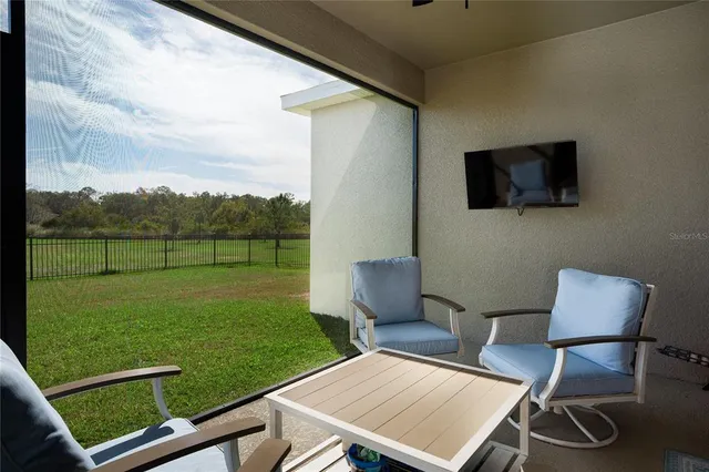 a view of a yard with a chair and a table