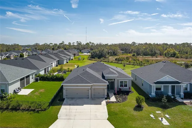 a aerial view of a house with a big yard
