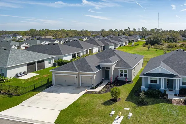 an aerial view of a house with a garden