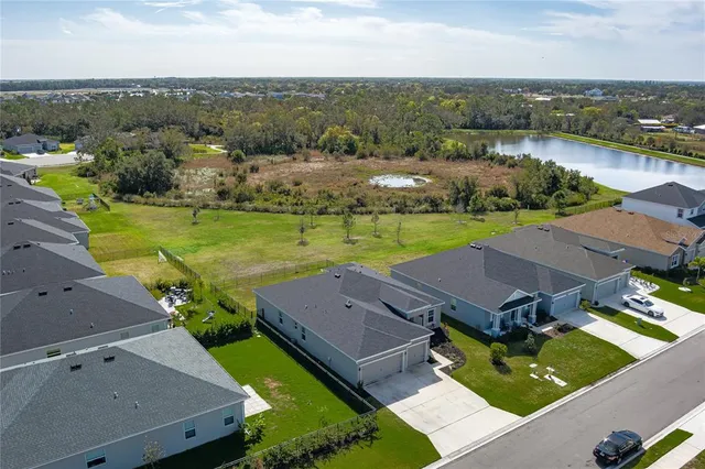 an aerial view of a house with outdoor space