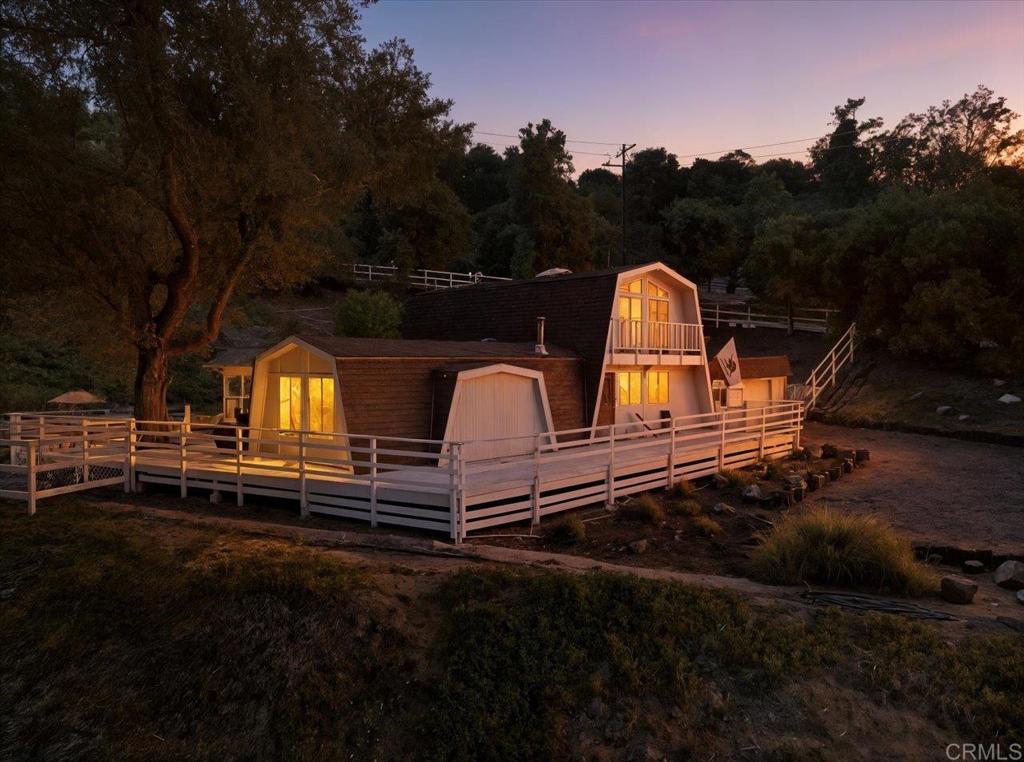a backyard of a house with a yard fire pit and outdoor seating