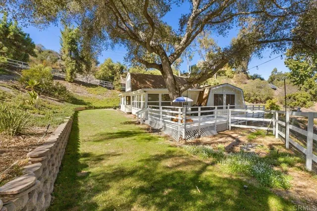 a swimming pool with outdoor seating and yard
