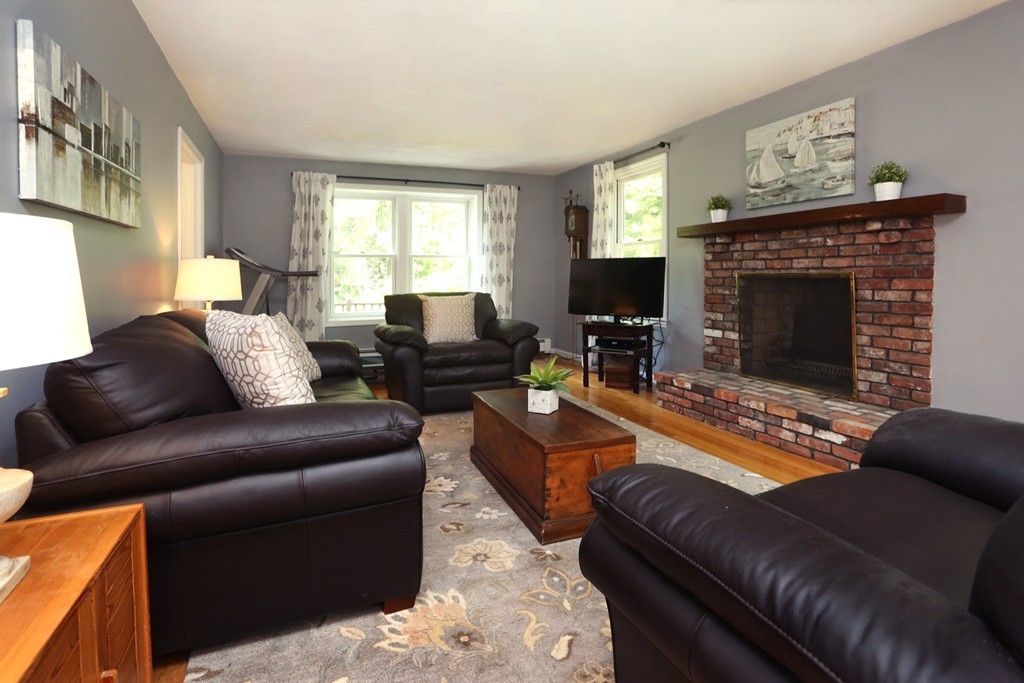 56 Rowley Road Boxford, MA 01921 - Photo 11 of 30 a living room with furniture and a fireplace