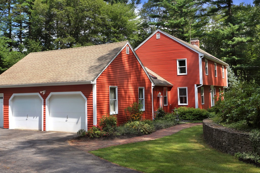 56 Rowley Road Boxford, MA 01921 - Photo 2 of 30 a front view of a house with a yard and garage
