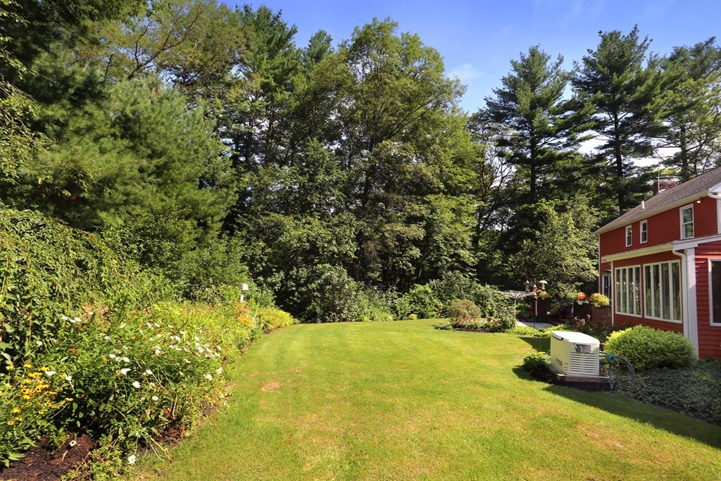 56 Rowley Road Boxford, MA 01921 - Photo 24 of 30 a view of swimming pool with lawn chairs and plants